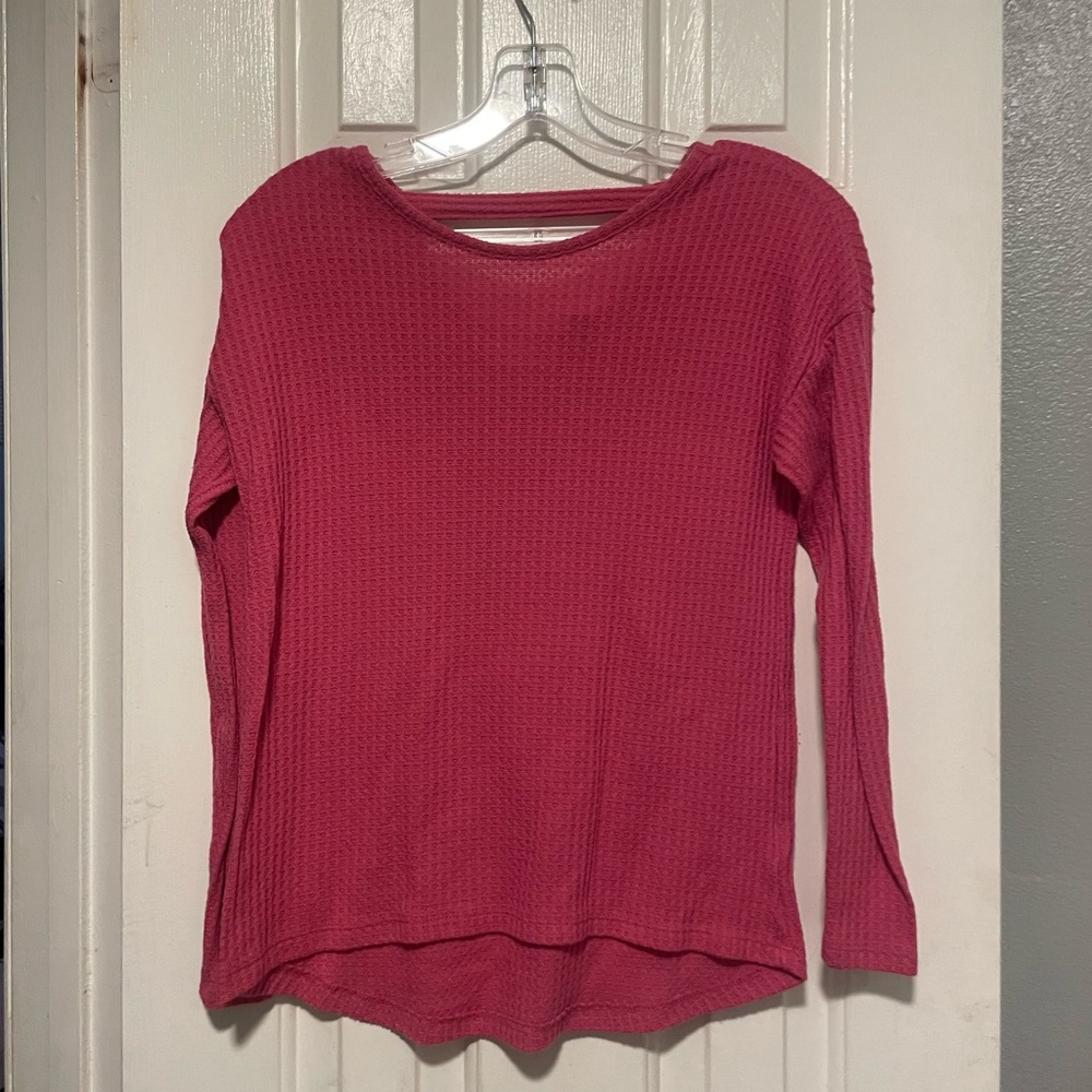 Pink children place sweatshirt